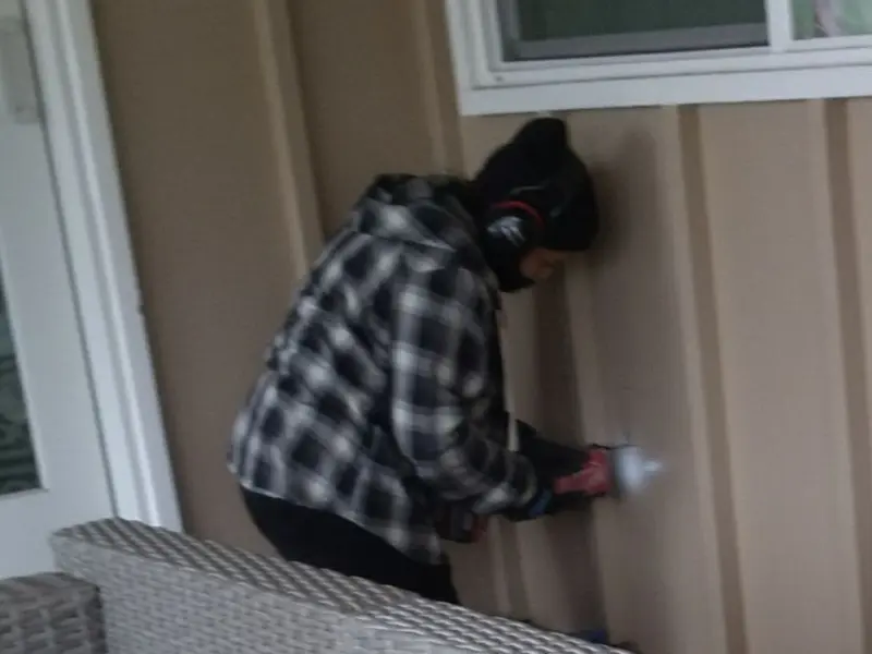 Professional electrician installing an exterior outlet in Lake Lorraine