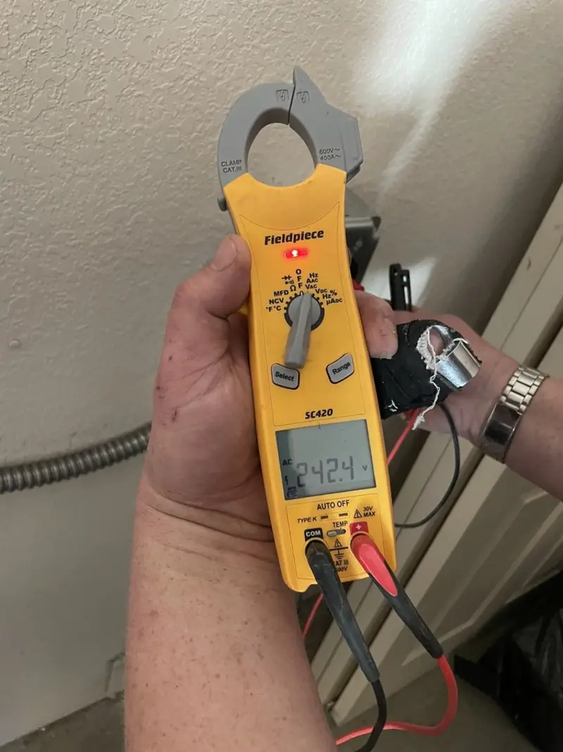 Voltage testing with clamp meter during Aluminum Wiring Replacement in Lake Lorraine